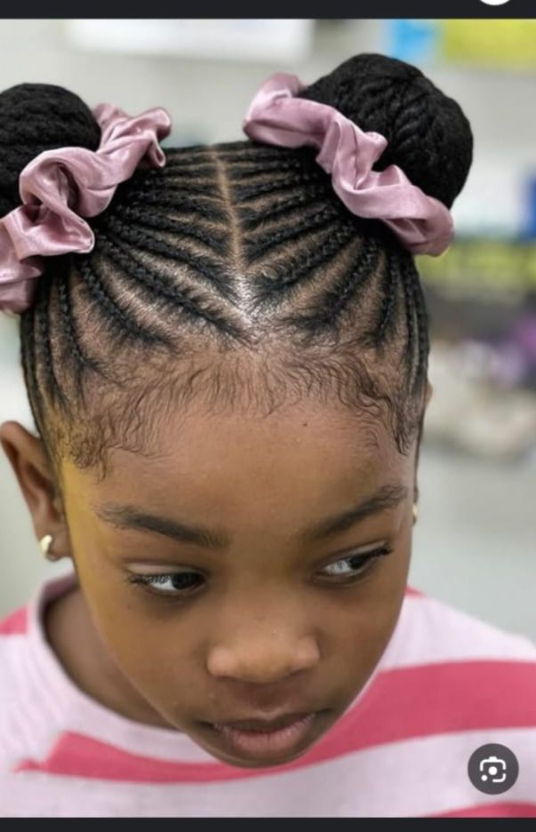 Space buns with pink satin scrunchies and cornrows